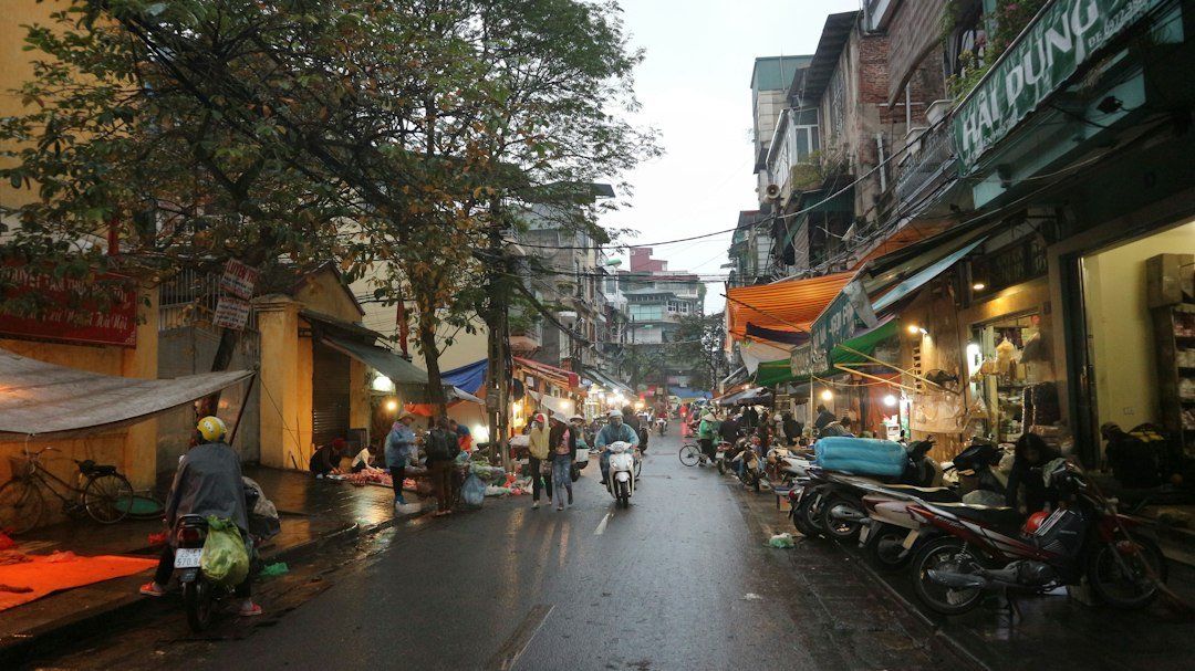 Motorbikes moving through a street in Hanoi